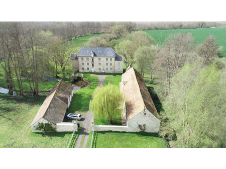 a vendre beau moulin de plus de 300 m2 habitables avec dépendances sur un parc de 4 hectar