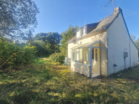 charmante maison de 2 chambres à trebrivan avec 802m² de terrain  avec chambre au rez-de-c