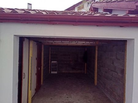 garage fermé 14m² + 13m² de mezzanine