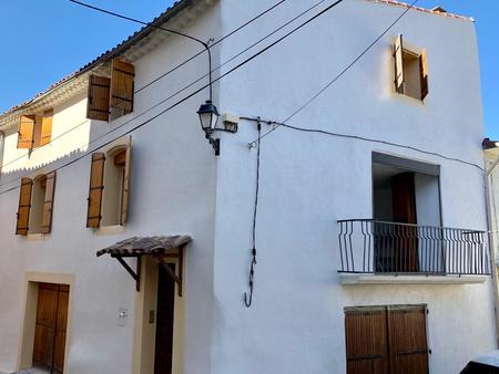 maison de village entièrement rénovée avec 4 chambres  balcon et grand garage.
