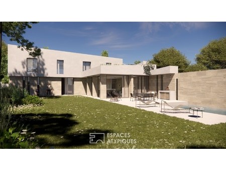 découvrez cette villa haut de gamme de 215m² avec piscine et jardin offrant le luxe contem