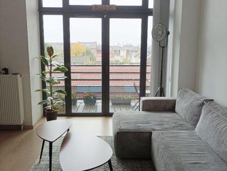 appartement type loft - t3 - 67 m² habitables + balcon + place de parking au sous-sol