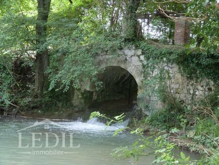 moulin à restaurer avec grange et terrain