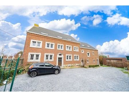 ferme avec 5 logements et un terrain à bâtir