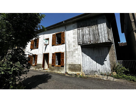 maison de village avec jardin et garage à fort potentiel