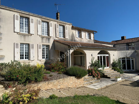 ancien presbytère d'environ 345m² habitable dans le centre de montravers avec piscine